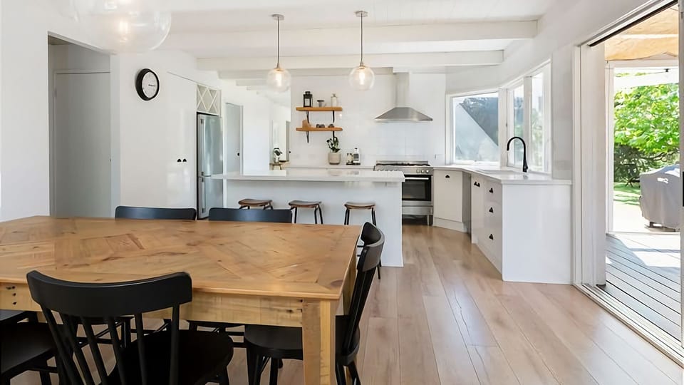 Open plan living, dining and kitchen leading into the conservatory.