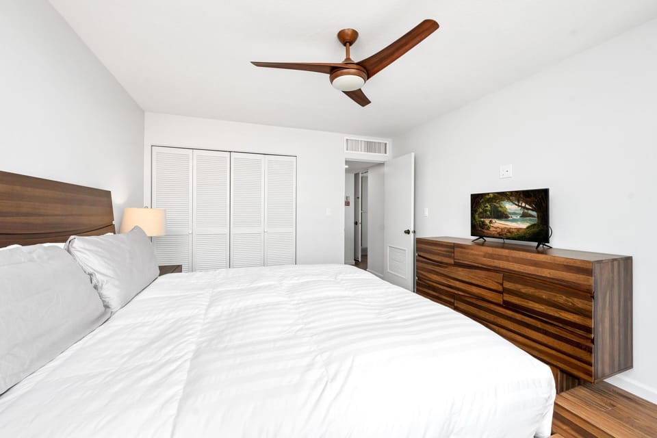 King bed in a modern, stylish bedroom with central A/C for ultimate comfort and restful sleep.
