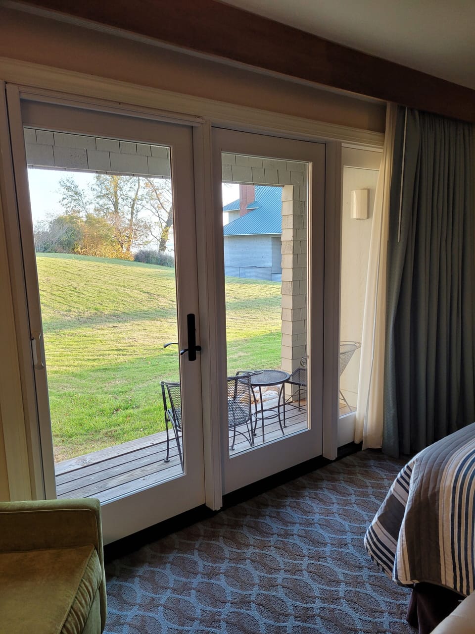 Private deck with view of the James River and an open, grassy area