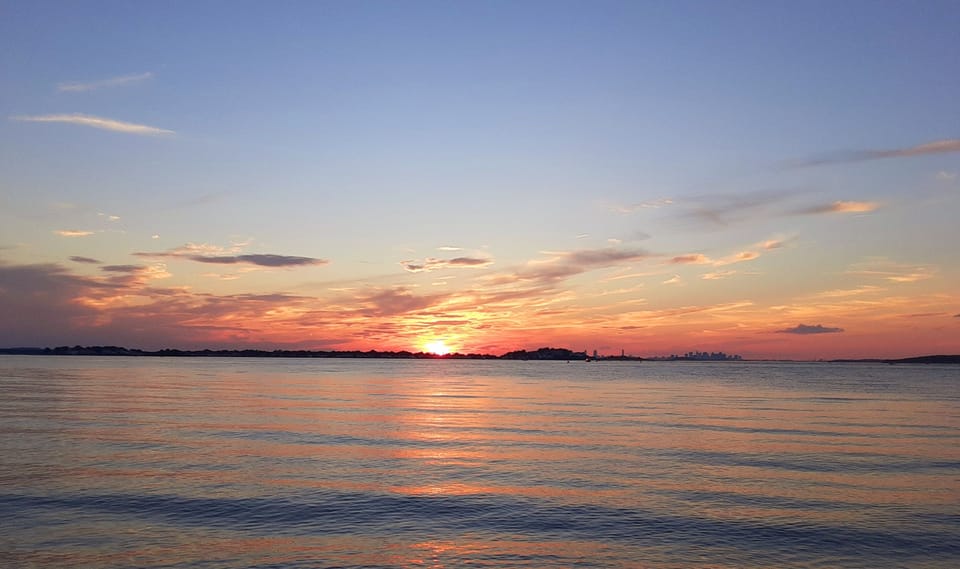 Local beach (Carson Beach) at sunset.