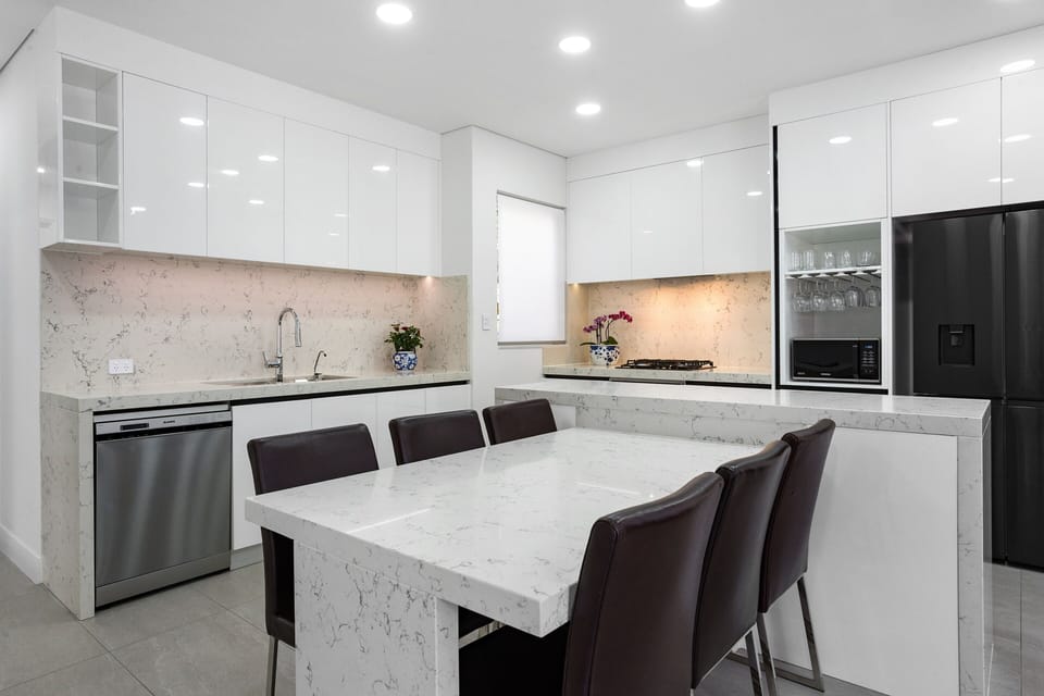 Kitchen has Blanco oven, dishwasher, filtered water, French door fridge and more