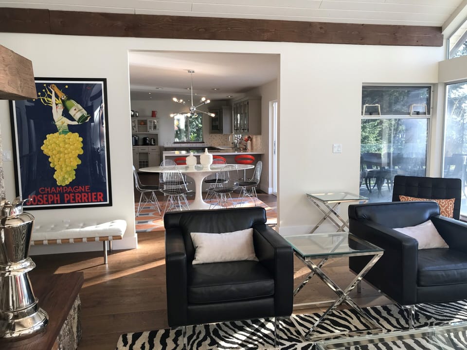 Open-concept living room with mid-century decor - bright & cheerful yet elegant