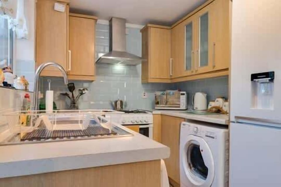 A fully equipped kitchen - including a washing machine.