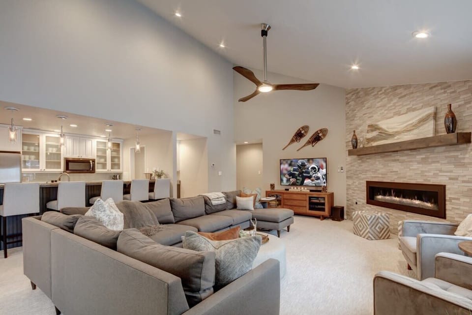 Living Room: Cozy up by the gas fireplace in this sun-filled mountain retreat.