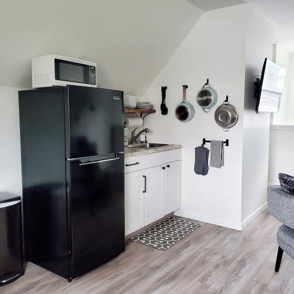 A coffee machine with Folgers coffee, teas, creamer, and sugar are provided.
Let us know if you need anything during your stay!