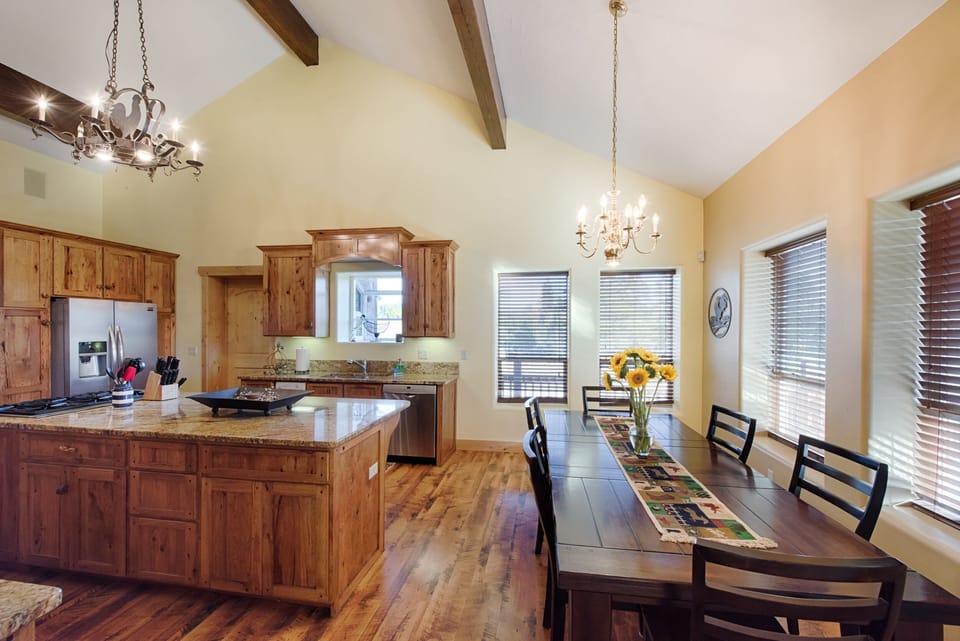Bright space, dining room table with chair and bench seating.
