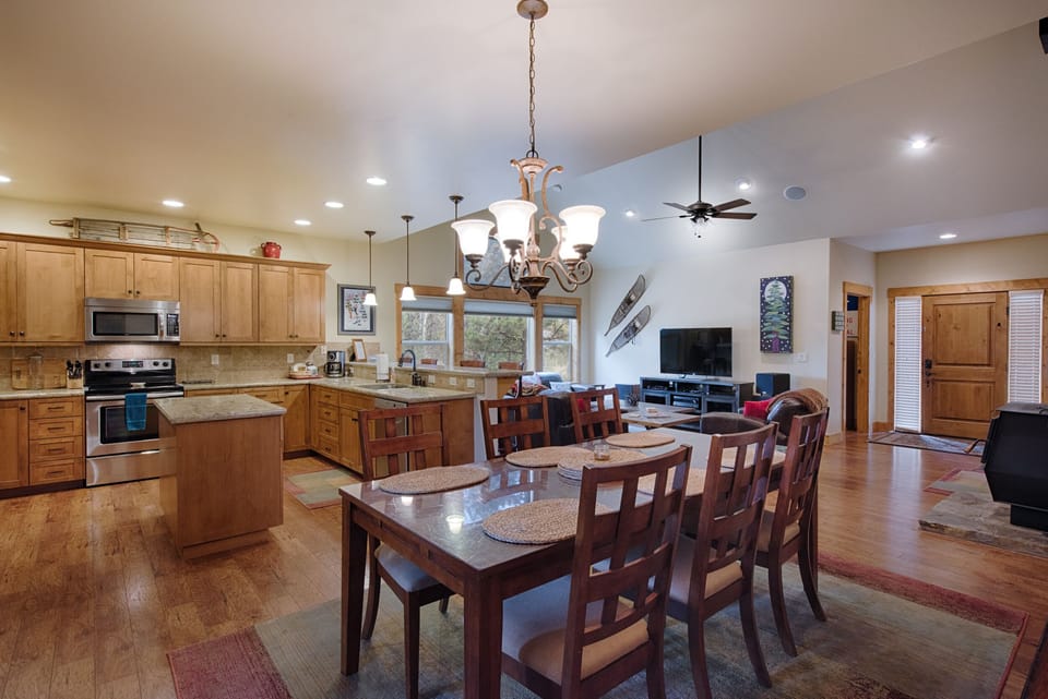 Large, well lit kitchen with stainless appliances.