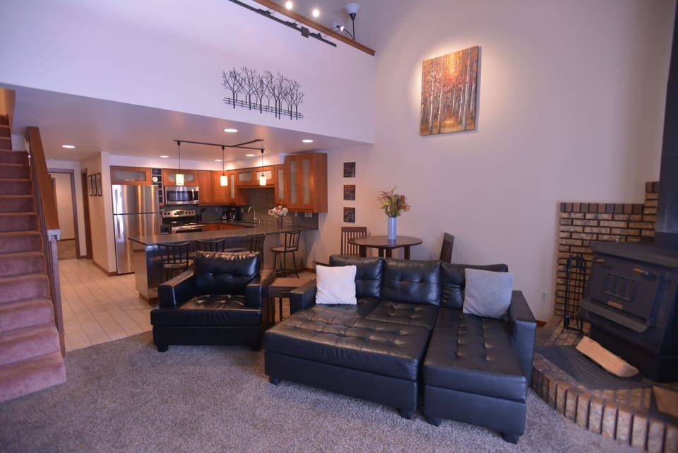 Spacious living space with wood burning stove.