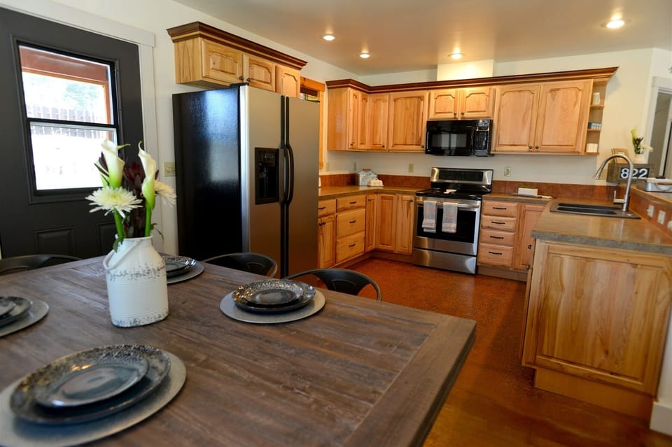 Kitchen access to screen in porch.  Dine Al Fresco.