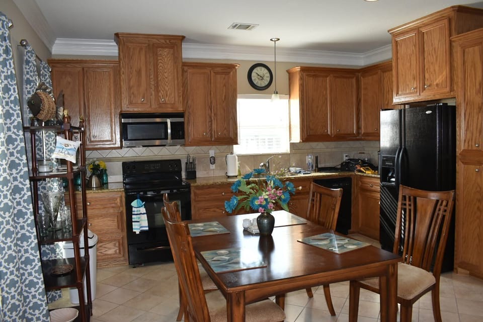 Full kitchen with granite countertop and dishwasher