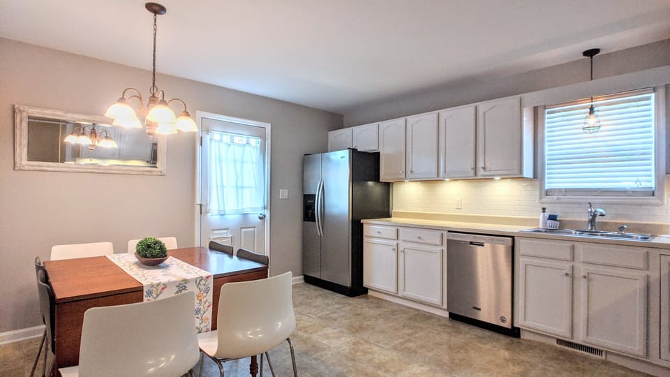 Spacious kitchen with dining area.