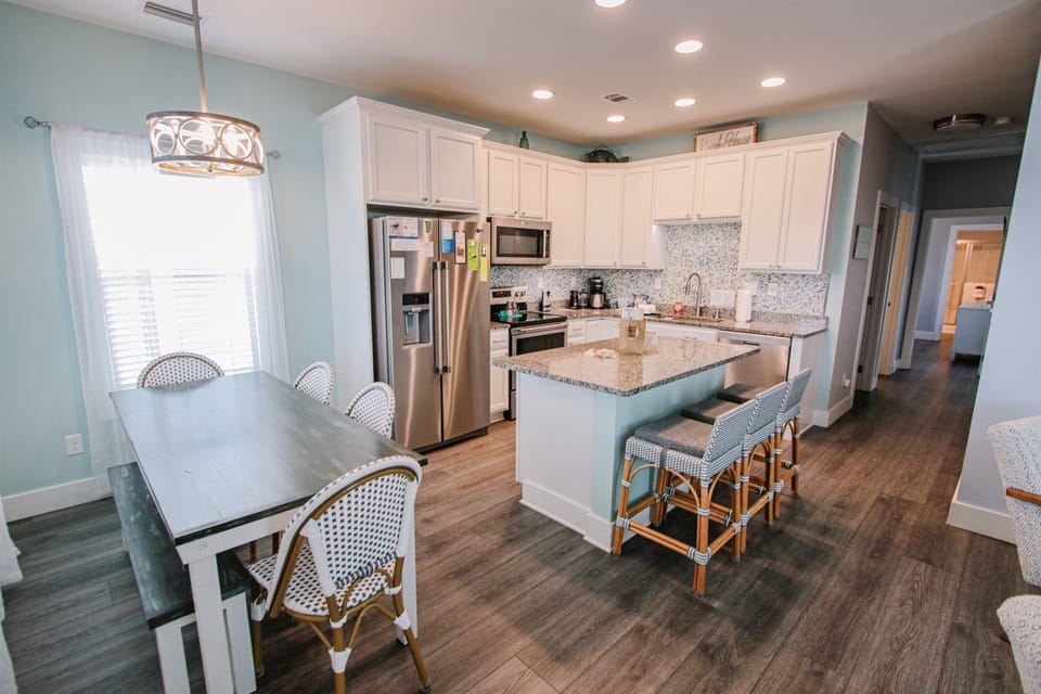Dining room and kitchen with seating for 9