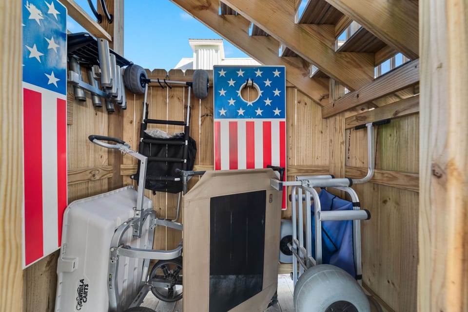 Multiple Beach Carts, an Outdoor Dog Bed, and Cornhole