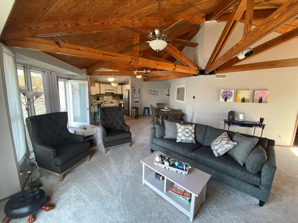 New furniture provides a comfy place to gather and watch TV or enjoy the view.