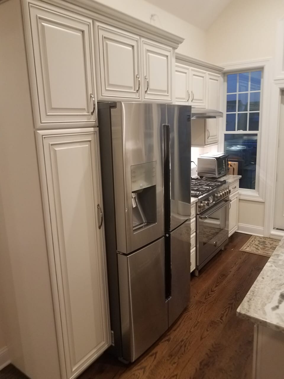 Samsung refrigerator and Bertozzoni 5 burner range and oven