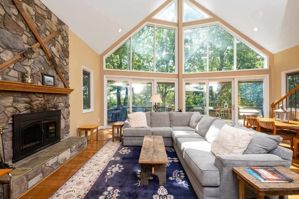 Luxurious Wintergreen Home with gorgeous wall of windows on main level.