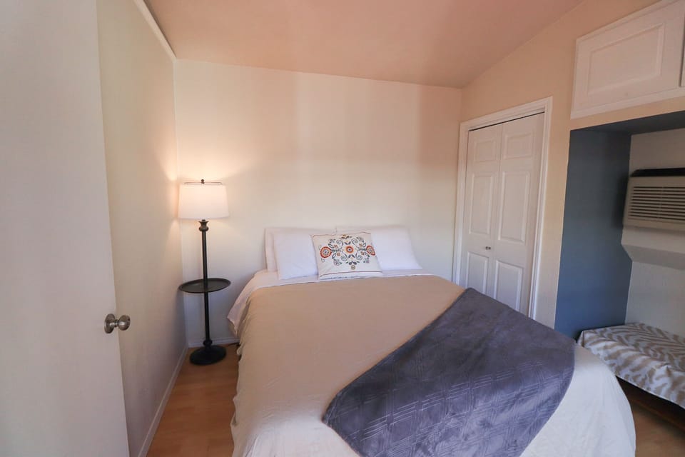 Bedroom 5, with a queen bed, is a part of its own unit.