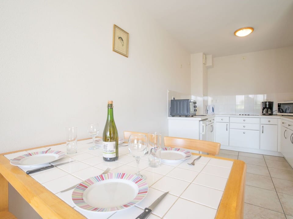 Property, Furniture, Cabinetry, Bottle, Table, Wood, Interior Design, Countertop, Kitchen Appliance, Tableware