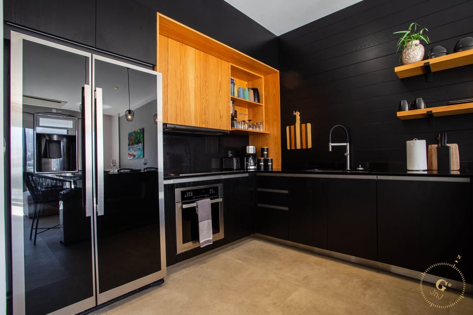 Fully equipped kitchen with Full Size Refrigerator, Convection Oven, Glass cooktop, Dishwasher & Microwave. We also supply Coffee, Creamer & Sugar so you can enjoy a beverage on the balcony watching the town come to life