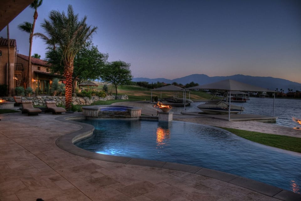 Enjoy sunset mountain views over the lake from the infinity pool.