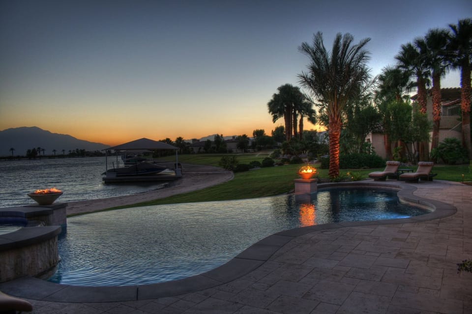 Enjoy sunset mountain views over the lake from the infinity pool.