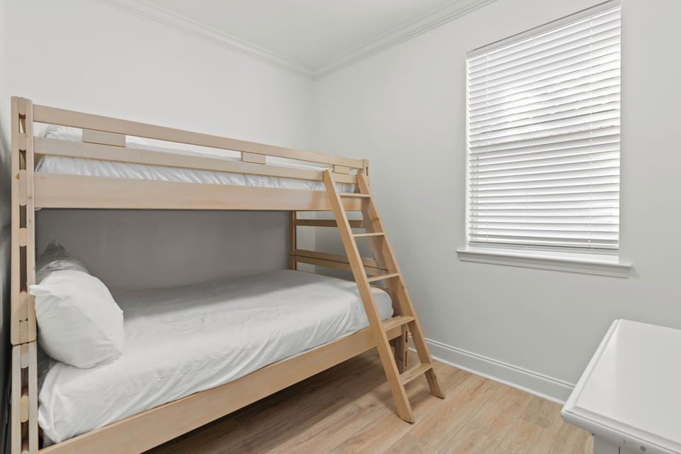 Bedroom 6 features a twin over full bunk bed.