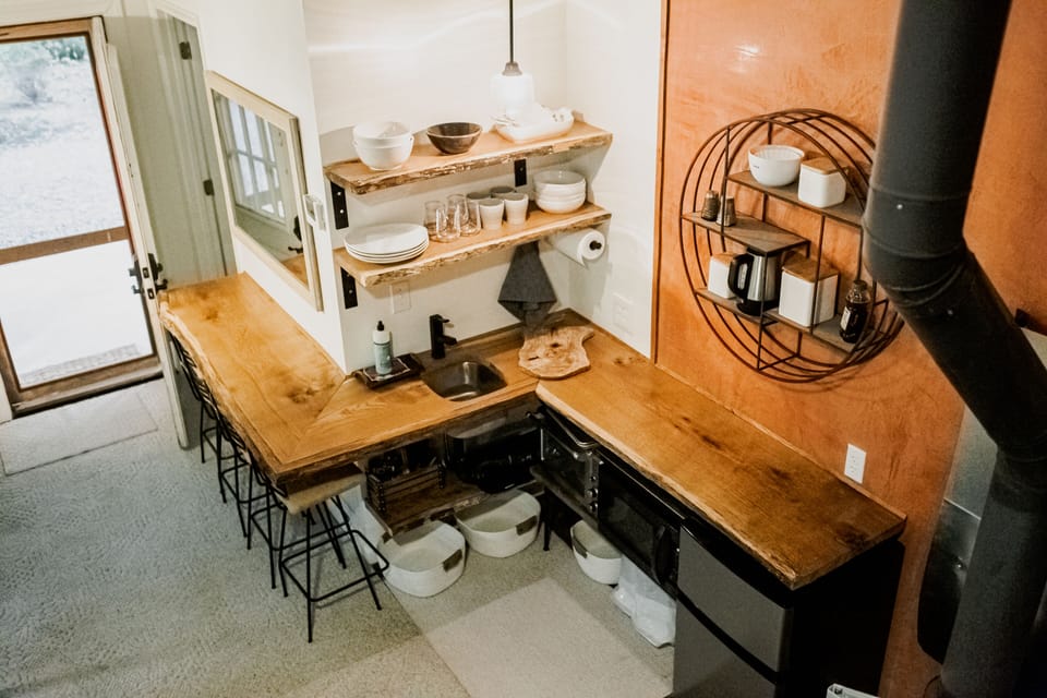Kitchen view from loft.  Fridge, 2 burner cooktop, microwave, small convec oven.