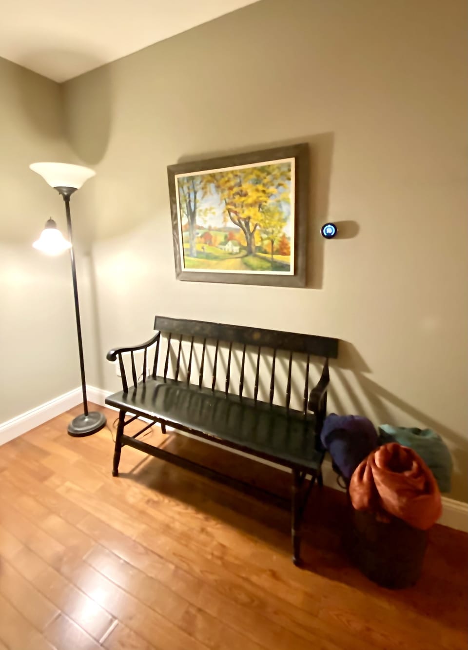 Casual sitting area between Great Room & hallway leading to main level bedrooms