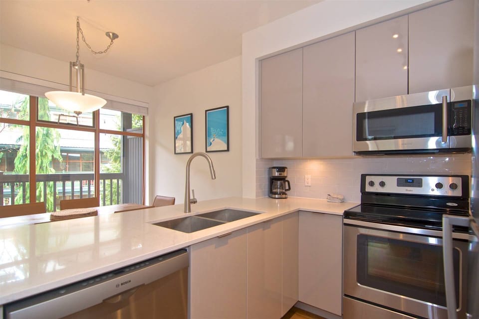 Looking into dining area ideal for visiting with guests while preparing meals