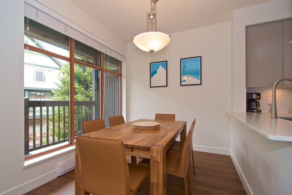 Cherry dining for 6 with large windows and open to kitchen