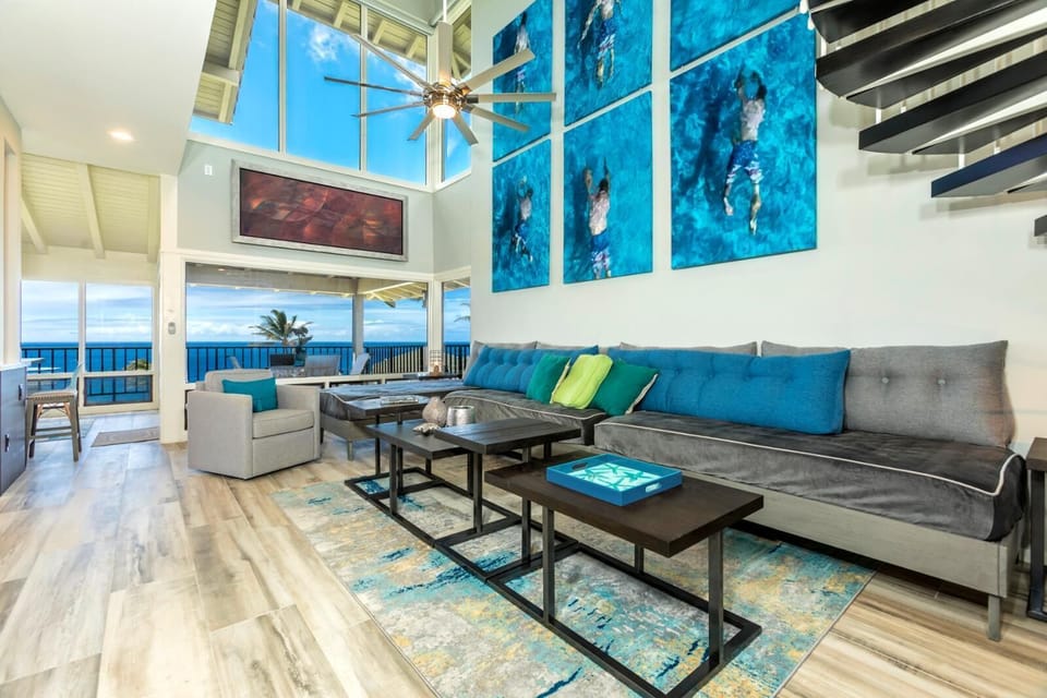  Soak in breathtaking ocean views from this designer living room with soaring ceilings and wall-to-wall glass   