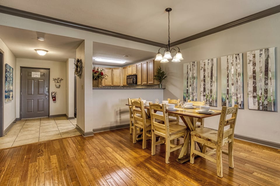 Dining area features a large wood table, perfect for dining in or playing games