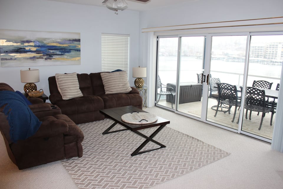 Enjoy the sounds of the lake by opening the sliding glass doors
