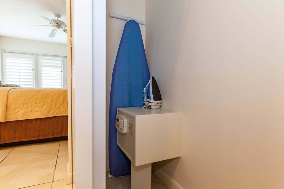 In room safe, and iron with ironing board.