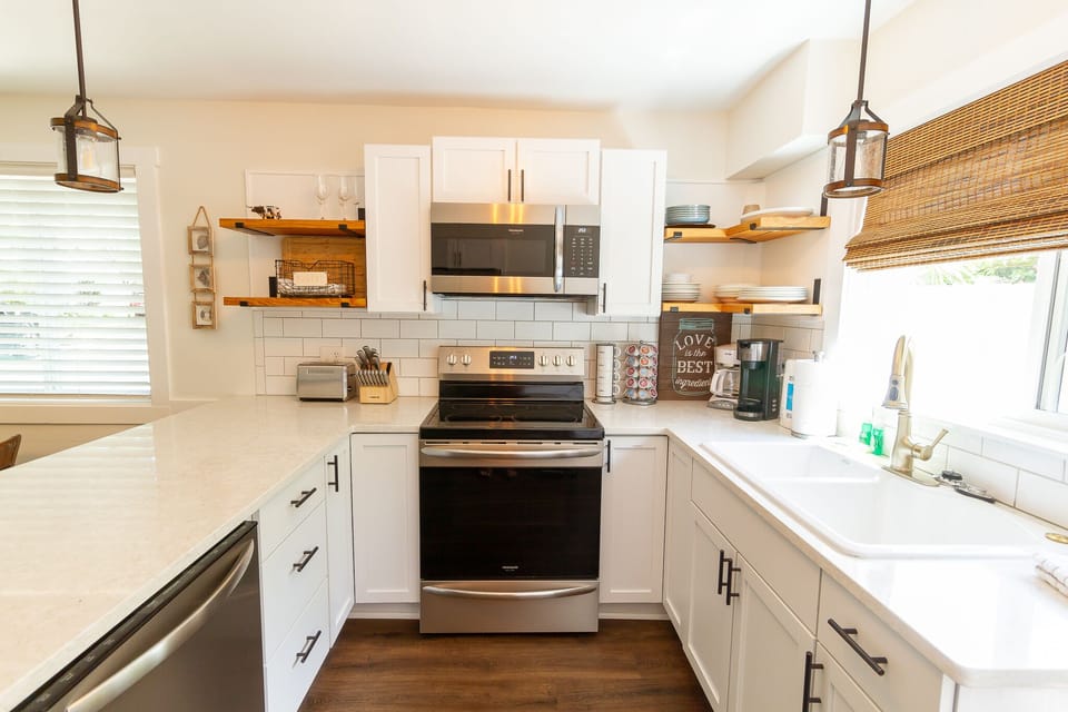Sun Filled Kitchen that is very well stocked. keurig & regular drip coffee maker