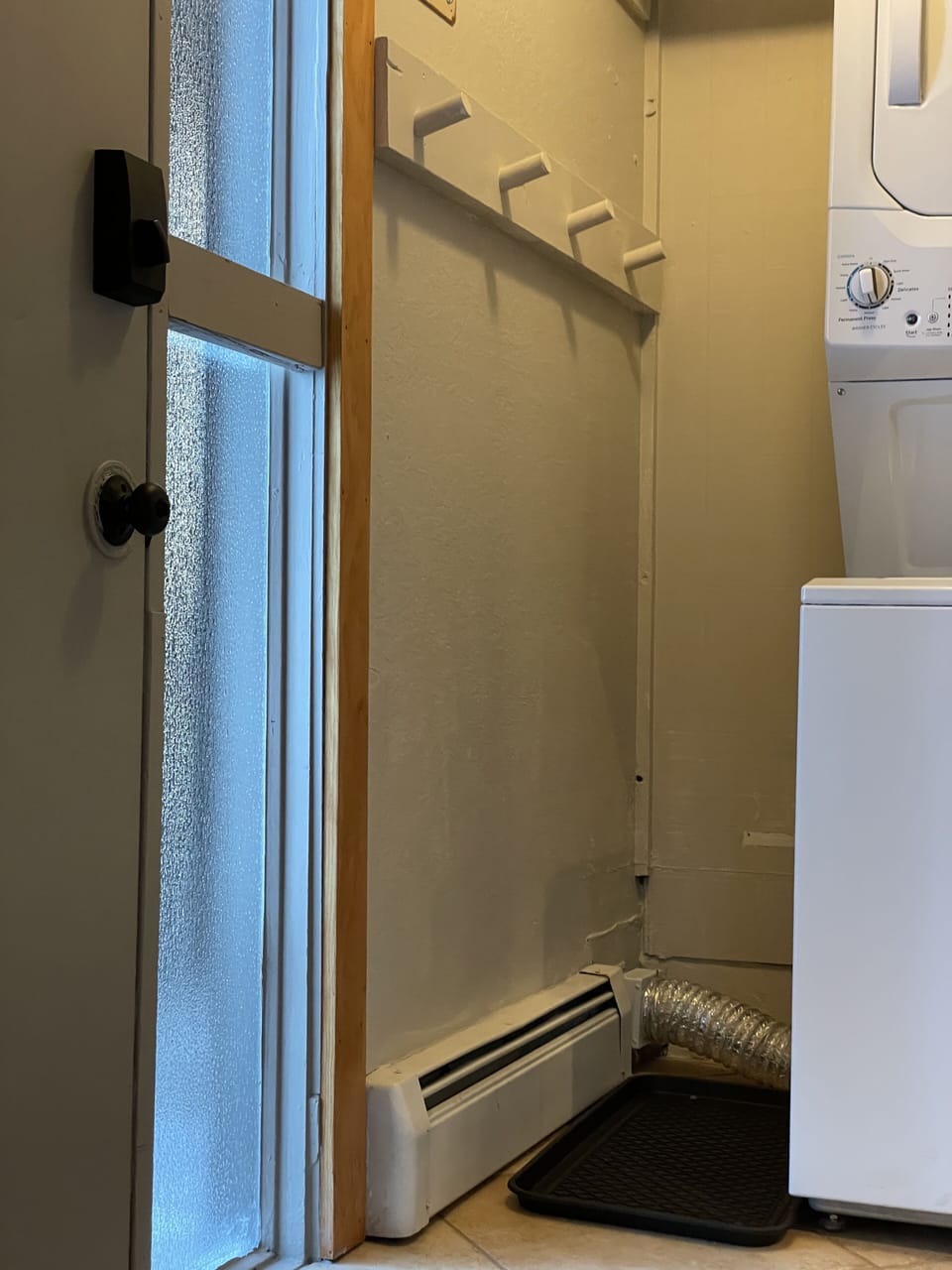 Entryway spot for all your winter gear! Full size washer and dryer as well!