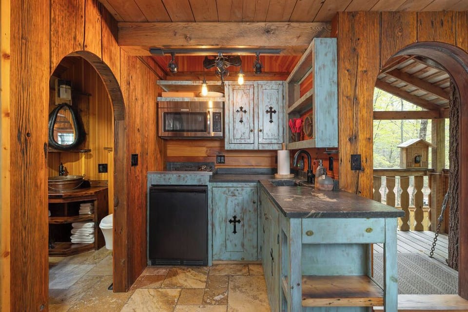 kitchen with 2 burner cooktop, under cabinet fridge and convection microwave