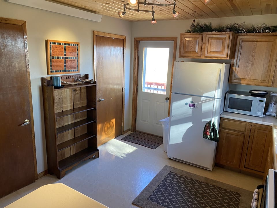 Kitchen area with shelf for food storage