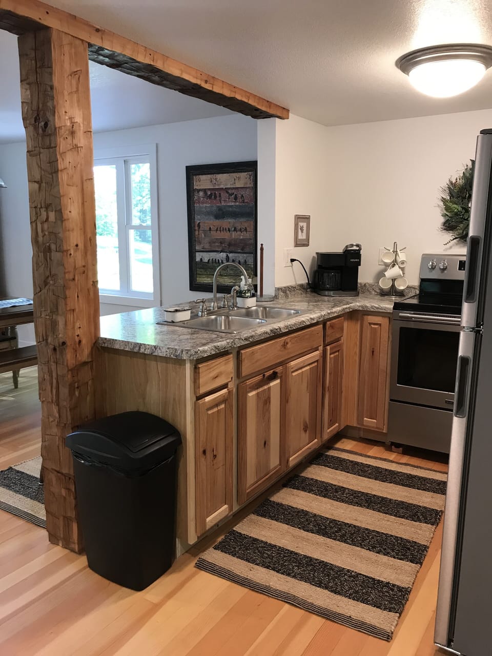 Kitchen includes Refrigerator, Stove, Microwave & Keurig Coffee Maker.