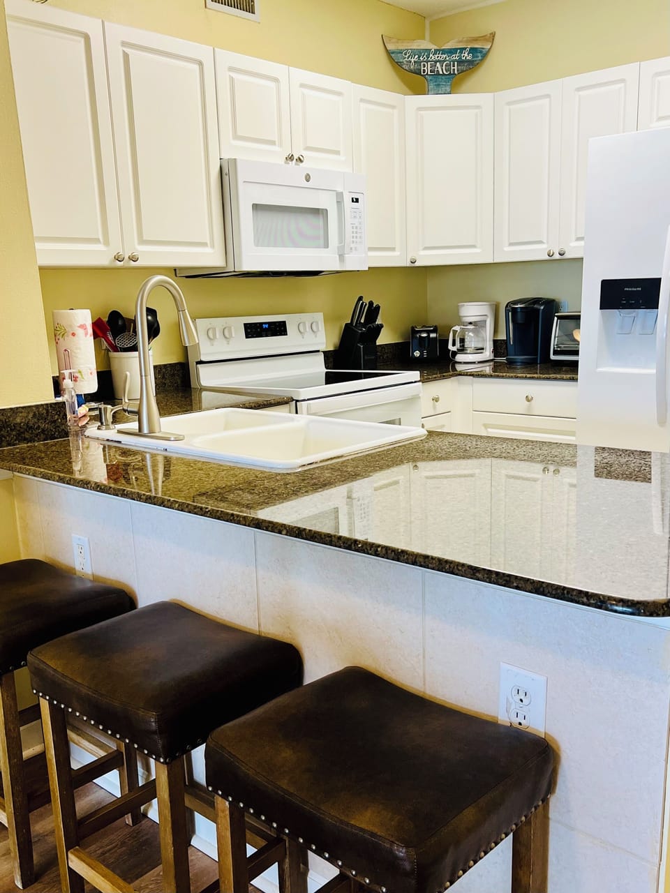 Barstools at the counter so you can keep the cook company