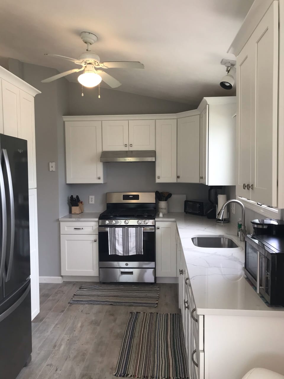 Fully renovated kitchen with stainless appliances and stone countertops 