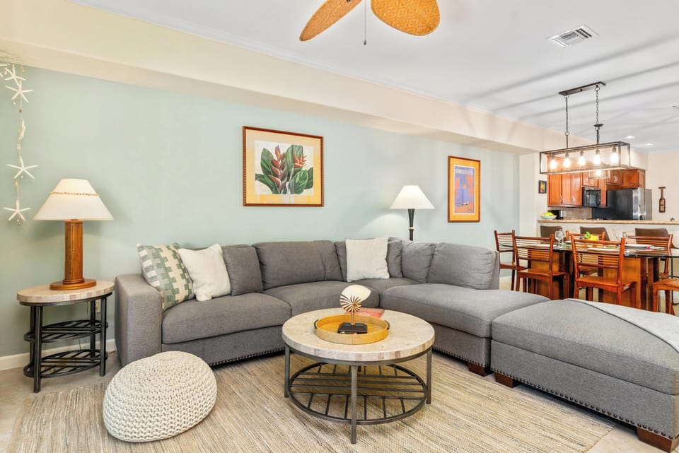 Bright, spacious living room with sliding doors to lanai