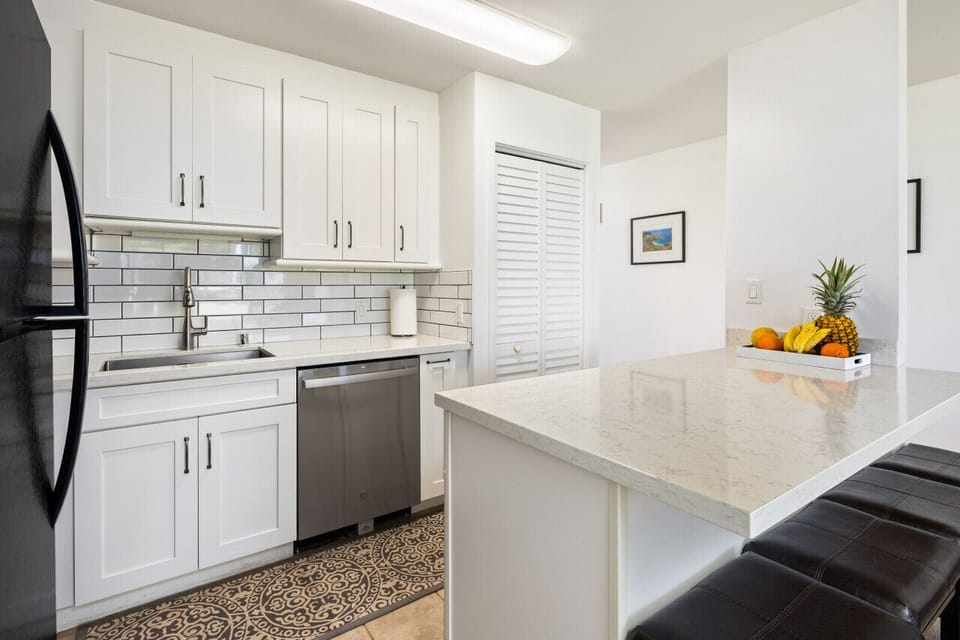 Sleek white kitchen ready for easy vacation cooking