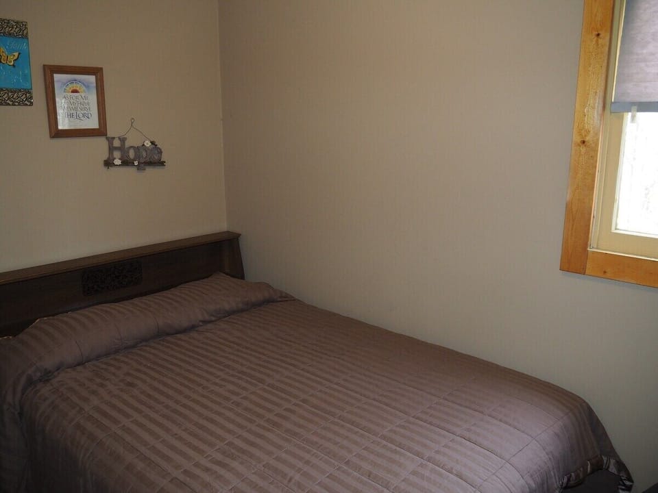 BEDROOM:  The bedroom features a double bed as well, allowing 6 people to sleep in the cabin.