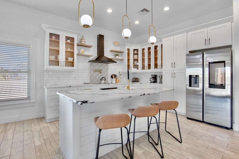 Chef's kitchen with marble island and appliances - 2nd floor