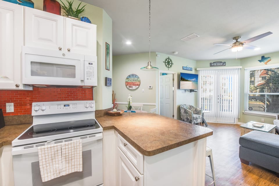 Open concept layout connecting the living and dining area to the kitchen