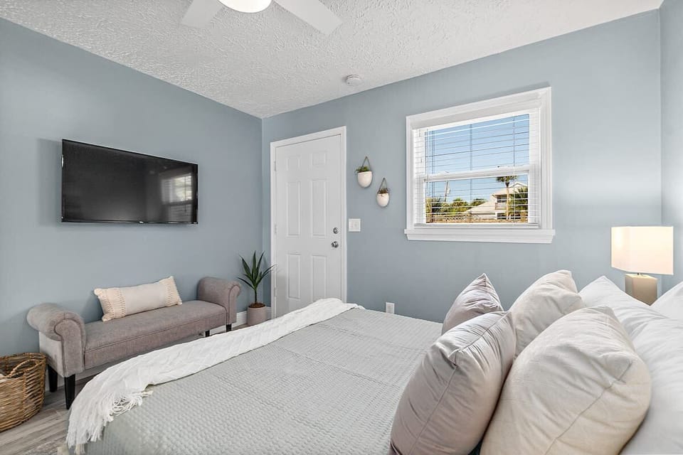 Flat screen TV with complimentary Netflix in the bedroom.