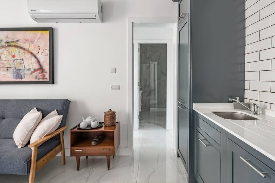 living - kitchen leading onto bathroom and bedroom