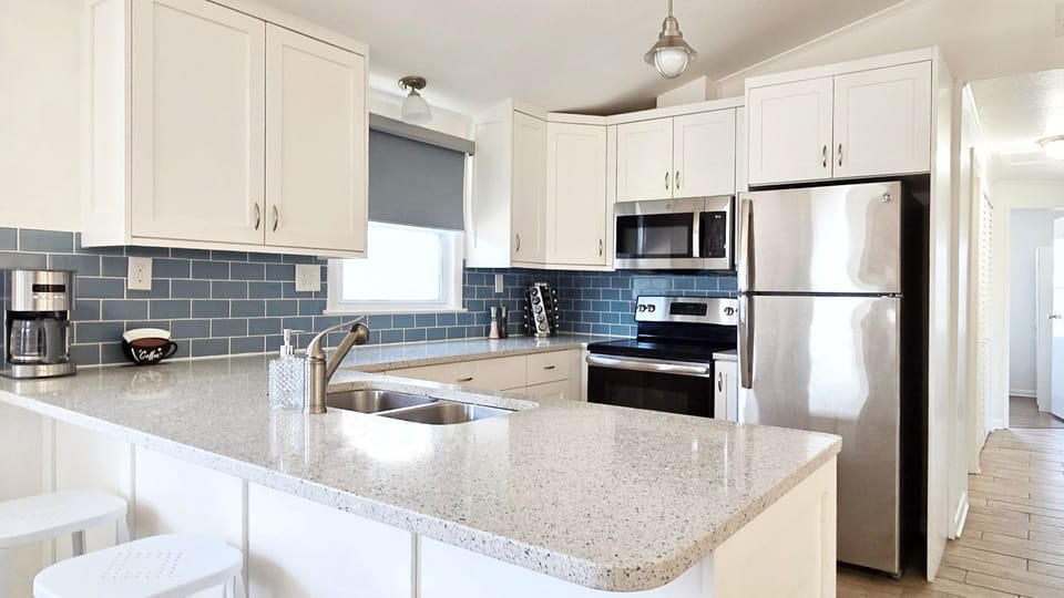 The kitchen is well-equipped and the appliances are full-size