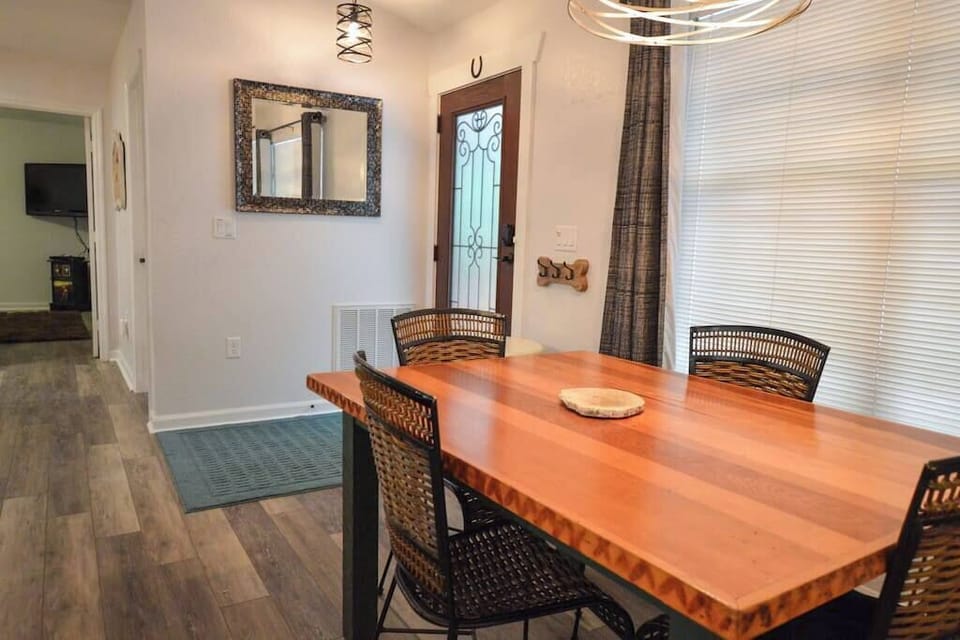 Indoor dining table seating for four with additional seats at the Bar.